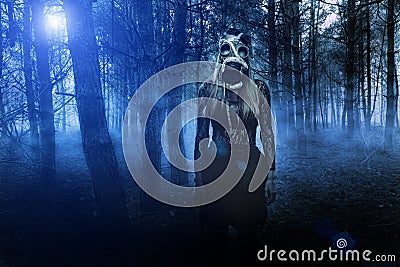 Woman in gas mask with snake in the forest Stock Photo