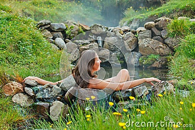 Woman in geothermal spring Stock Photo