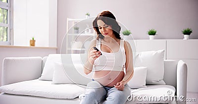 Woman With Gestational Diabetes At Home Stock Photo