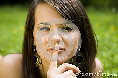 Woman gesturing for silence Stock Photo