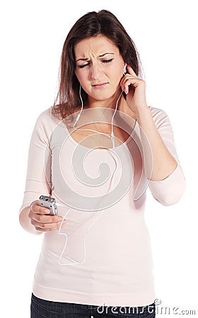 Woman getting earache from MP3 player Stock Photo