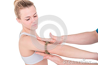 Woman getting hand acupuncture massage with Acupressure Finger Stock Photo