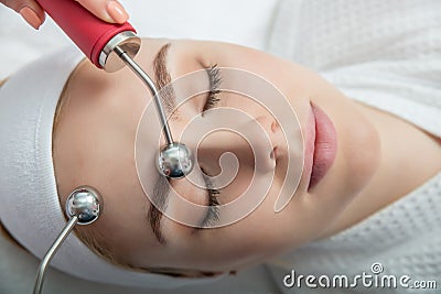 Woman getting lifting therapy massage in a beauty SPA salon Stock Photo