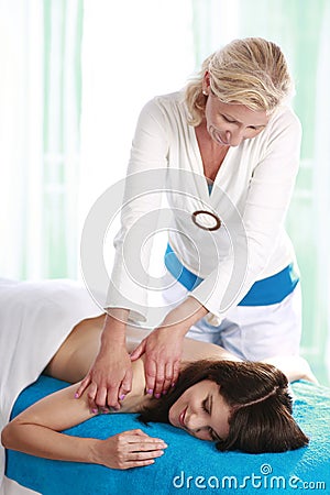 Woman getting massage in day spa Stock Photo