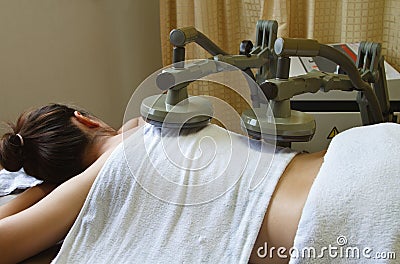 Woman getting physical therapy,treatment muscle wi Stock Photo