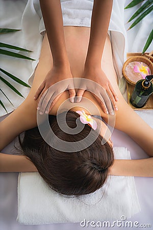 Woman getting spa body massage treatment at beauty spa salon Stock Photo