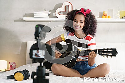 Woman Girving Guitar Class On Internet With Video Tutorial Stock Photo