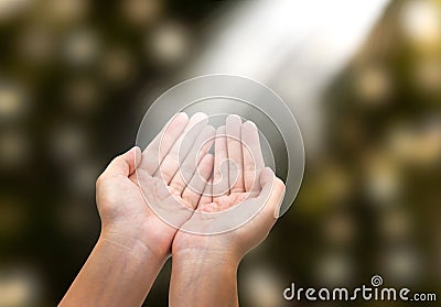 woman giving or holding hands, glowing lights Stock Photo