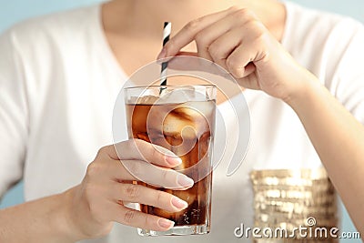 Woman with glass of tasty refreshing cola, closeup Stock Photo