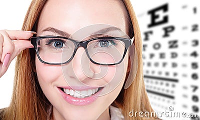 Woman with glasses and eye test chart Stock Photo