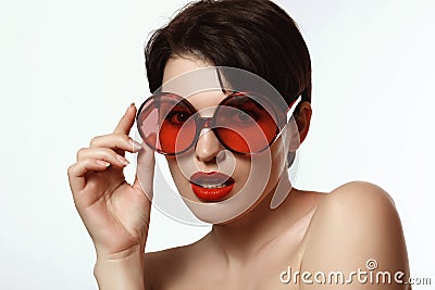 Woman in glasses with red lenses Stock Photo