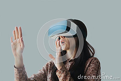 The woman with glasses of virtual reality. Future technology concept. Modern imaging technology. Stock Photo