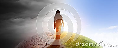 Woman on a globe from darkness into light Stock Photo