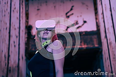 Woman goes into virtual reality using virtual reality headset. Stock Photo