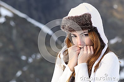 Woman going cold sheltered in winter outdoors Stock Photo