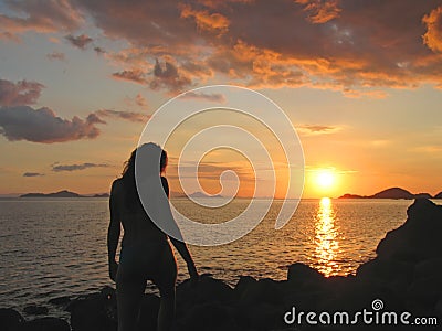 A woman going to take a bath Stock Photo