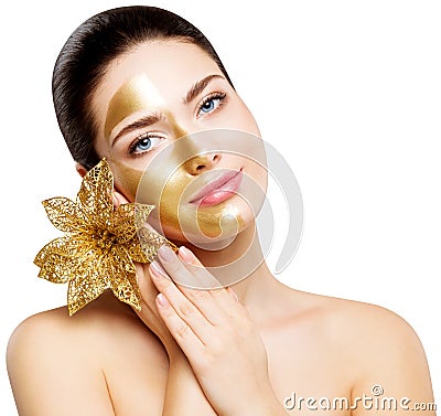 Woman Gold Mask, Beautiful Model Golden Facial Skin Cosmetic, Colored Half Face, Beauty Skincare and Treatment Stock Photo