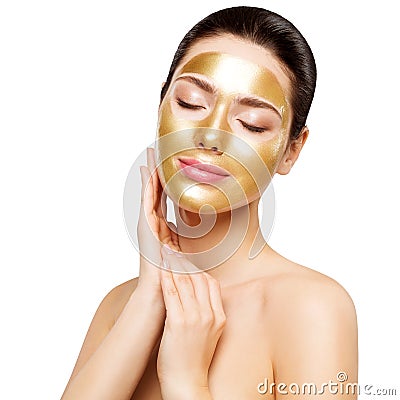 Woman Gold Mask, Beautiful Model with Golden Skin Cosmetic touch Face, Beauty Skincare and Treatment Stock Photo