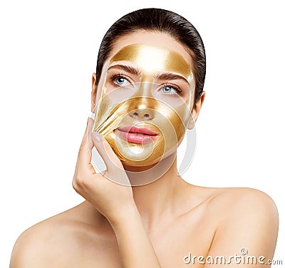 Woman Gold Mask, Beautiful Model Removing Golden Facial Skin Cosmetic, Beauty Skincare and Treatment Stock Photo