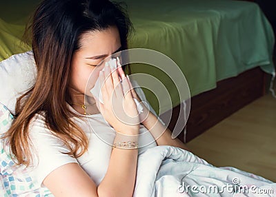A woman got sick and sneeze Stock Photo