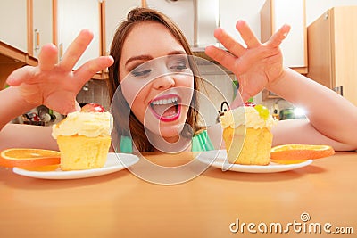 Woman grabbing delicious sweet cake. Gluttony. Stock Photo