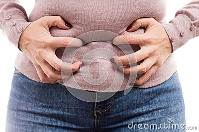 Woman grabbing her belly as painful abdominal problem Stock Photo