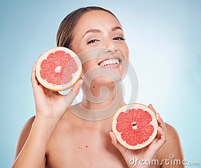 Woman, grapefruit and facial skincare wellness for natural beauty, salon spa care and luxury organic treatment in blue Stock Photo