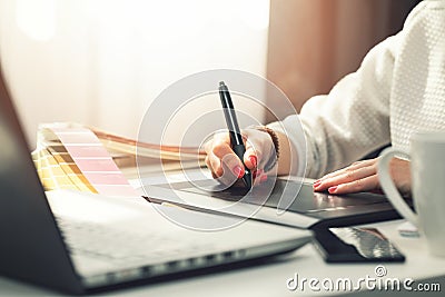 Woman graphic designer using digital drawing tablet Stock Photo