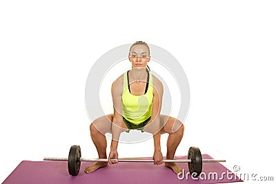 Woman green fitness tank top dead lift front Stock Photo