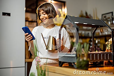 Woman growing sprouts on kithcen at home Stock Photo