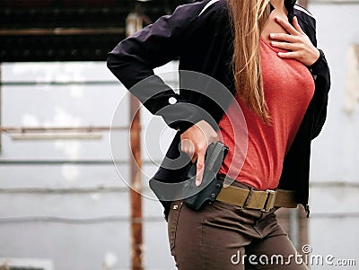Woman with gun Stock Photo