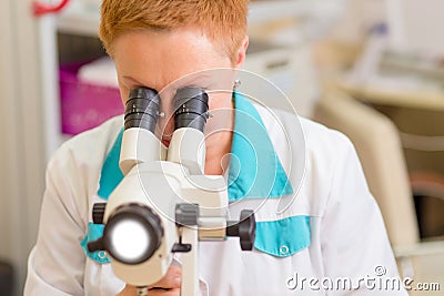 Woman gynecologist working with colposcope Editorial Stock Photo