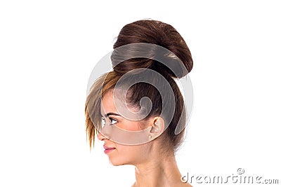 Woman with hair in a bun standinf sidewise Stock Photo