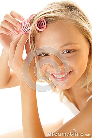 Woman with hair curler Stock Photo