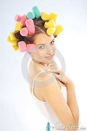 Woman in hair curlers Stock Photo