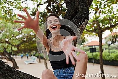 sitting woman nature leisure smiling lifestyle vacation sea sky relax tree Stock Photo