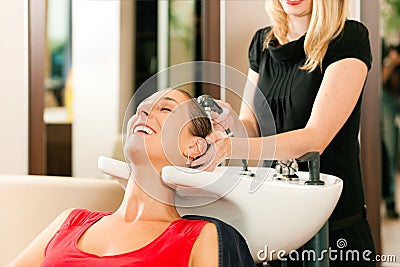 Woman at the hairdresser Stock Photo