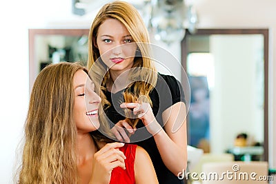 Woman at the hairdresser getting advise Stock Photo