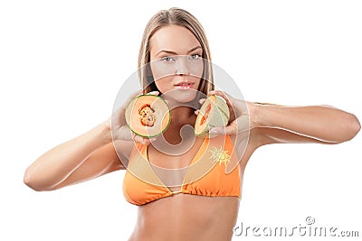 Woman with halves of cantaloupe Stock Photo