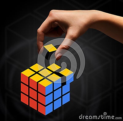 Woman hand builds cube rubik concept, collage Editorial Stock Photo