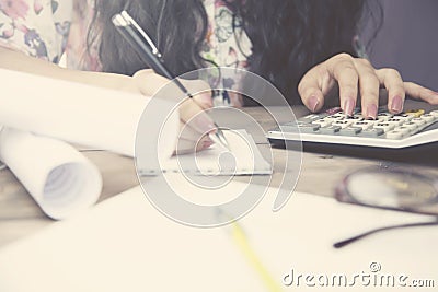 Woman hand calculator and pen Stock Photo