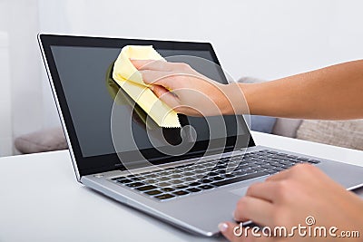 Woman Hand Cleaning Laptop Screen Stock Photo