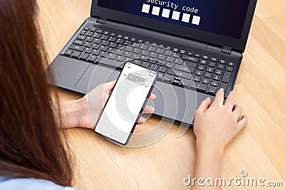 Woman hand enter a one time password for the validation process, Mobile OTP secure Verification Method, 2-Step authentication web Stock Photo