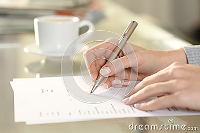 Woman hand filling out checkbox form at home Stock Photo