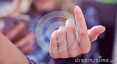 Woman hand gesturing come here calling you lying on the couch and holding smartphone in hand Stock Photo