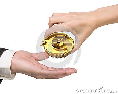 Woman hand giving currency symbol gear to man hand Stock Photo