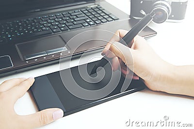 Woman hand on graphic tablet Stock Photo