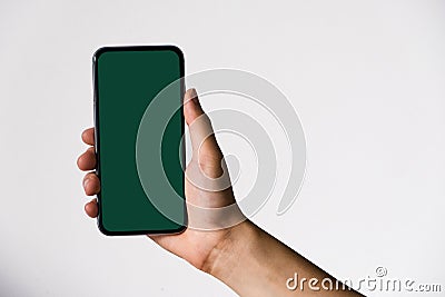 Woman hand grasp black smart with stylish borderless green screen. Stock Photo