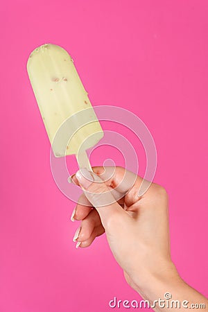 Sweet Summer Delight: Green Ice Cream Popsicle on Stick Stock Photo