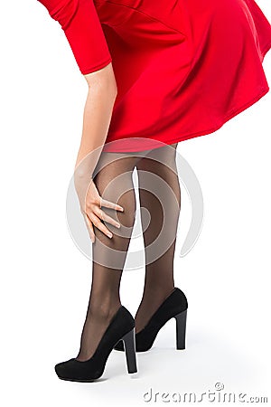 Woman with hand on her leg Stock Photo